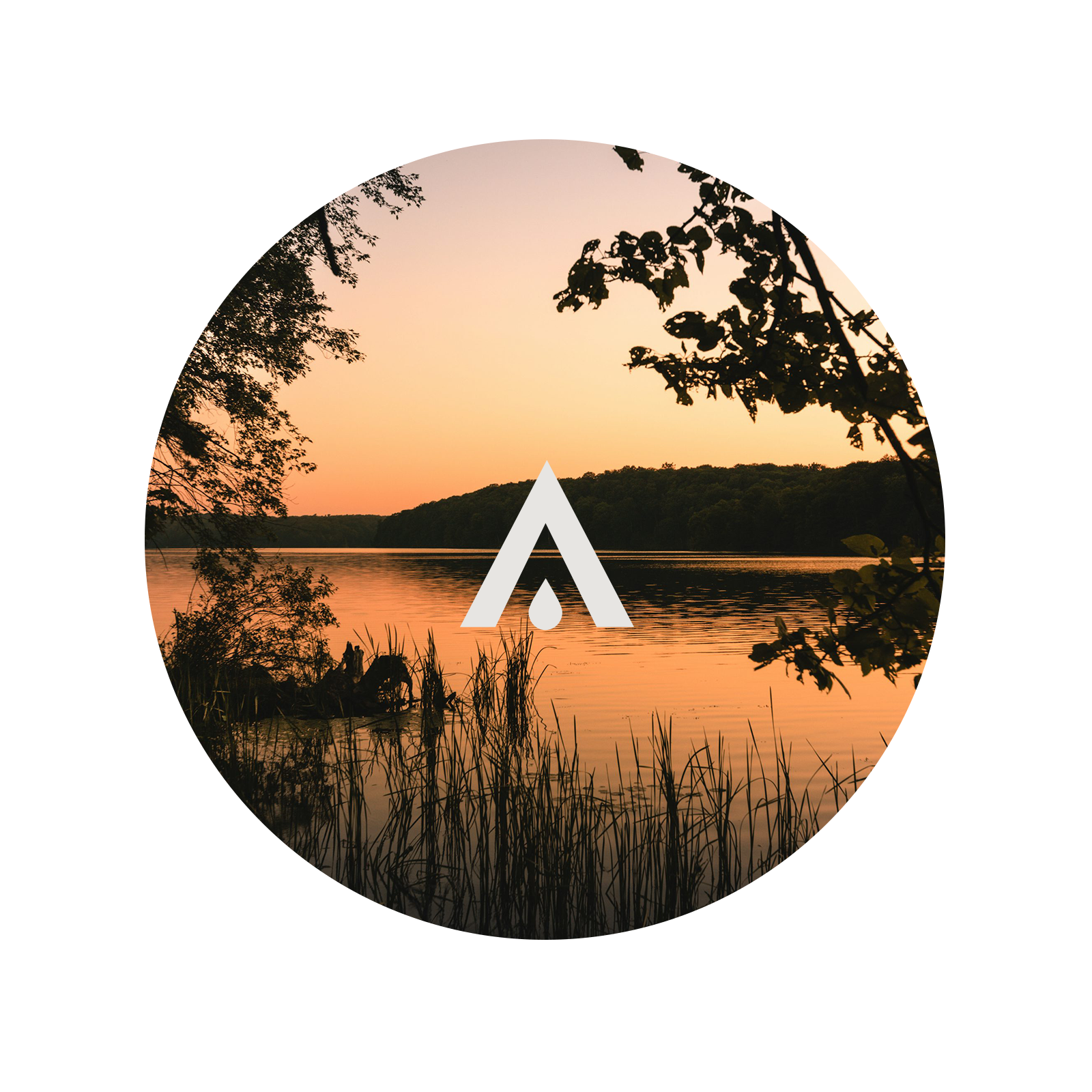 Circular image of a sunset over a lake with trees and a logo in the center.