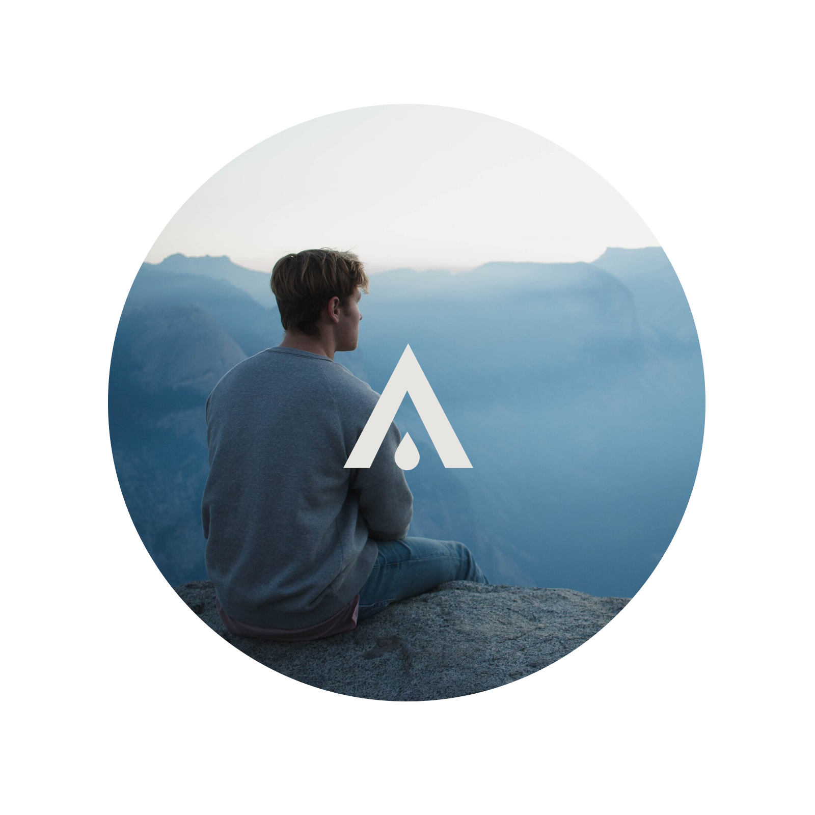 Person sitting on a rock with mountains in the background, featuring a logo overlay.